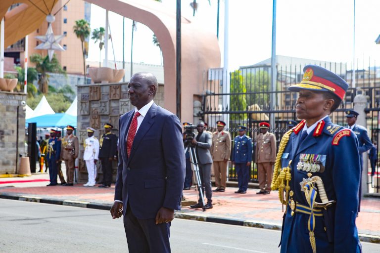 Kenyan President William Ruto (L) and Major General Fatuma Gaiti Ahmed (R) the commander of the Kenya Air Force, after inspecting a guard of honor mounted by Kenya Air Force officers upon his arrival at the Parliament building for his annual State of the