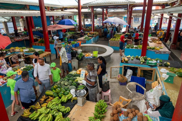 People shopping tropical fruits at Victoria market, Mahe island, Seychelles