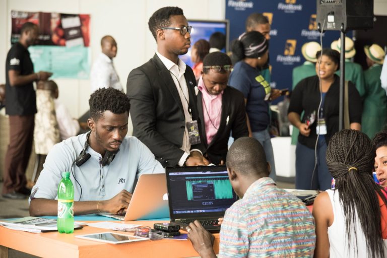 Young Nigerian people using technology at Social Media Week business conference in Lagos Nigeria